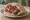 Shawarma b'Kmaj (شاورما بالكماج): an illustration of chicken, beef, lamb, garlic sauce and more.