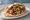 Shawarma b'Pita (שווארמה בפיתה): an illustration of turkey, lamb, beef, hummus and more on pita.