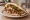 Shawarma Charif (שווארמה חריף): an illustration of turkey, lamb, beef, tahini and more on pita.