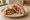 Shawarma Djej (شاورما دجاج): an illustration of chicken, garlic, lemon, yogurt and more on pita.