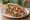 Shawarma Im HaKol (שווארמה עם הכל): an illustration of turkey, lamb, tahini, hummus and more on pita.
