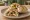Shawarma ma' Toum (شاورما مع توم): an illustration of chicken, garlic sauce, garlic, lemon and more on pita.