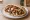 Shawarma Meurav (שווארמה מעורב): an illustration of turkey, lamb, tahini, tomato and more on pita.