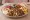 Shawarma Plate (صحن شاورما): an illustration of chicken, beef, lamb, garlic sauce and more on pita.