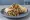 Shawarma Sandwich: an illustration of chicken, beef, lamb, garlic sauce and more on pita.