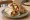 Shish Taouk Sandwich (ساندويش شيش طاووق): an illustration of chicken, garlic, lemon, yogurt and more on pita.