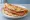 Shǒuzhuā Bǐng Jiā Huǒtuǐ (手抓饼夹火腿): an illustration of ham, pork, scallion and maggi seasoning sauce.