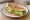 Shǒuzhuā Bǐng Jiā Shēngcài (手抓饼夹生菜): an illustration of lettuce, scallion, maggi seasoning sauce and olive oil.