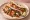 Shrimp Fajita: an illustration of shrimp, pepper, onion, lime and more on tortilla.