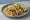 Shrimp Taco (USA): an illustration of shrimp, cabbage, lime, cilantro and more on tortilla.