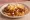Slinger: an illustration of hash browns, beef, egg, pepper and more.