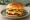 Smash Burger: an illustration of beef, american cheese, onion, pickle and more on burger bun.
