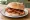 Smoked Bacon Butty: an illustration of bacon, butter, ketchup and brown sauce.