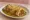 Smothered Green Chile Burrito: an illustration of beef, chicken, cheese and beans.
