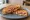 Sosisli Tost: an illustration of sausage, butter and ketchup on bread.