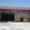 Storefront of Luigi's Sandwich Palace: a maroon awning reading "Sandwich Palace Deli & Caterers" over a glass entrance.