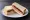 Spam and Pickle: an illustration of pork, pickle and butter on white bread.