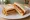 Spam Fritter Butty: an illustration of pork, butter and brown sauce on white bread.