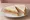 Spam Sandwich: an illustration of pork, butter and mustard on white bread.