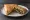 Spanakopita - Triangle (Τρίγωνο): an illustration of spinach, feta, onion, dill and more.