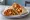 Spice Bag Wrap: an illustration of chicken, potato, bell pepper, onion and more on tortilla.