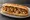 Spiedie Sub: an illustration of chicken, onion, pepper, olive oil and more on hoagie roll.