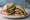 Ssamjang Steak Sandwich: an illustration of beef and garlic.