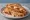 St. Louis-Style Pizza Sandwich: an illustration of american cheese, sausage, pork, marinara and more.