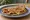 Staffordshire Oatcake with Bacon: an illustration of bacon, cheddar cheese and butter.