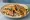 Steak Quesadilla (USA): an illustration of beef, cheese, onion, cilantro and more on tortilla.