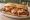 Steak Sandwich (Chicago): an illustration of beef, onion, provolone and giardiniera.