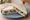 Stilton and Grape: an illustration of butter on white bread.