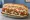 Stinger Sub: an illustration of beef, chicken, hot sauce, blue cheese and more on hoagie roll.