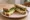 Stinking Bishop Sandwich: an illustration of watercress and butter on white bread.