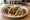 Street Taco (USA): an illustration of beef, pork, chicken, onion and more on tortilla.