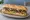 Subway China (赛百味): an illustration of beef, lettuce, tomato, onion and more on hoagie roll.