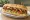 Subway Korea — K-BBQ Chicken: an illustration of chicken, bbq sauce, lettuce, tomato and more on hoagie roll.