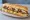 Subway Polska: an illustration of beef, chicken, pork, lettuce and more on hoagie roll.