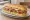 Subway-style Sandwich: an illustration of ham, turkey, salami, provolone and more on hoagie roll.