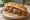 Sucuk Sandwich: an illustration of sucuk, beef, garlic, tomato and more.