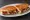 Sucuklu Tost: an illustration of sucuk, cheese and butter on bread.
