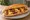 Sucuklu Yumurta Ekmek: an illustration of sucuk, egg and butter on bread.