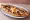 Sucuklu Yumurtalı Pide: an illustration of sucuk, egg and cheese on pita.