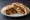 Sujuk b'Bayd (سجق بالبيض): an illustration of beef, egg and garlic on pita.