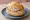 Sülze Brötchen: an illustration of pork, onion and vinegar on kaiser roll.
