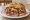 Super Beef: an illustration of beef, mushroom, pepper and mayonnaise on kaiser roll.
