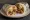 Super Burrito: an illustration of rice, beans, beef, cheese and more on tortilla.