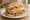 Súper Lomito: an illustration of pork, cheese, ham, egg and more on baguette.