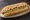 Super Pancho: an illustration of hot dog, avocado, tomato, mayonnaise and more on hot dog bun.