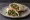 Tabbouleh Sandwich (ساندويش تبولة): an illustration of parsley, tomato, onion, mint and more on pita.